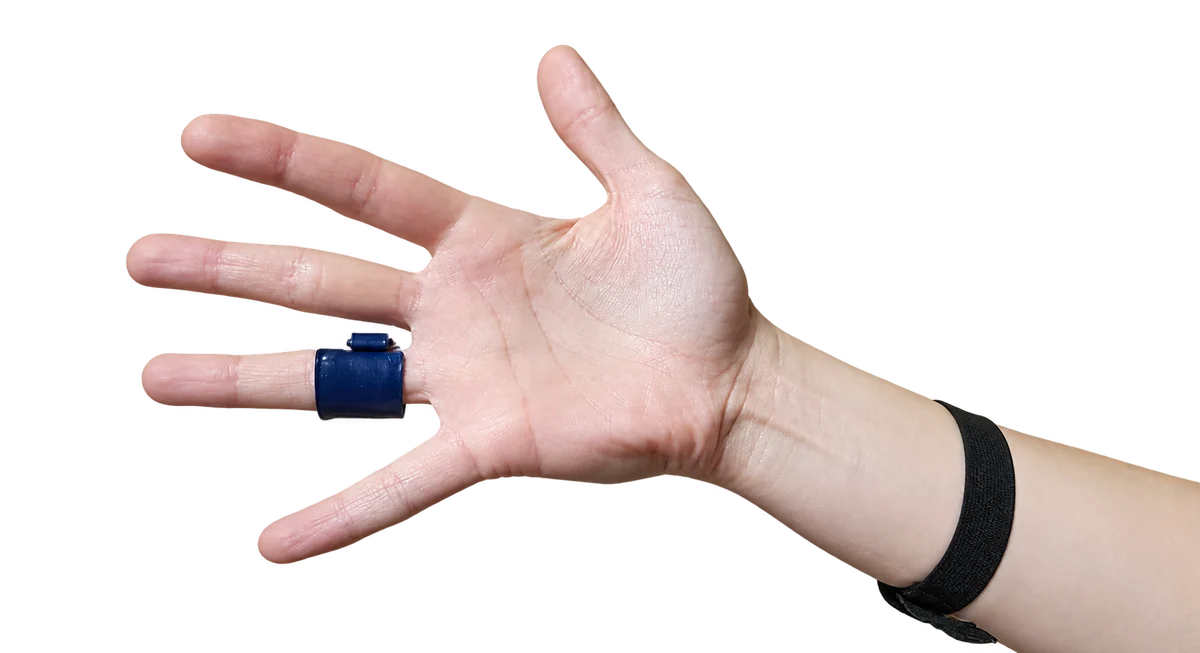buttonsens force sensor attached to a finger, with loadpad electronics worn at the wrist